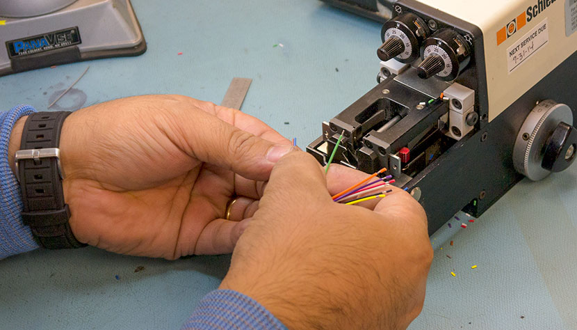A worker splicing cable